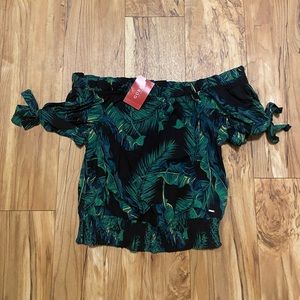 Black blouse with green leaves